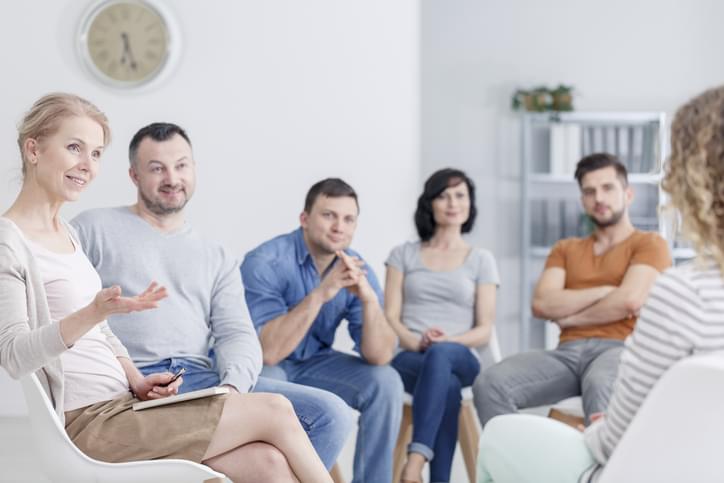 Therapist congratulating woman on progress