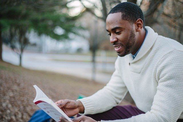 Man reading a book avoiding alcohol withdrawal symptoms