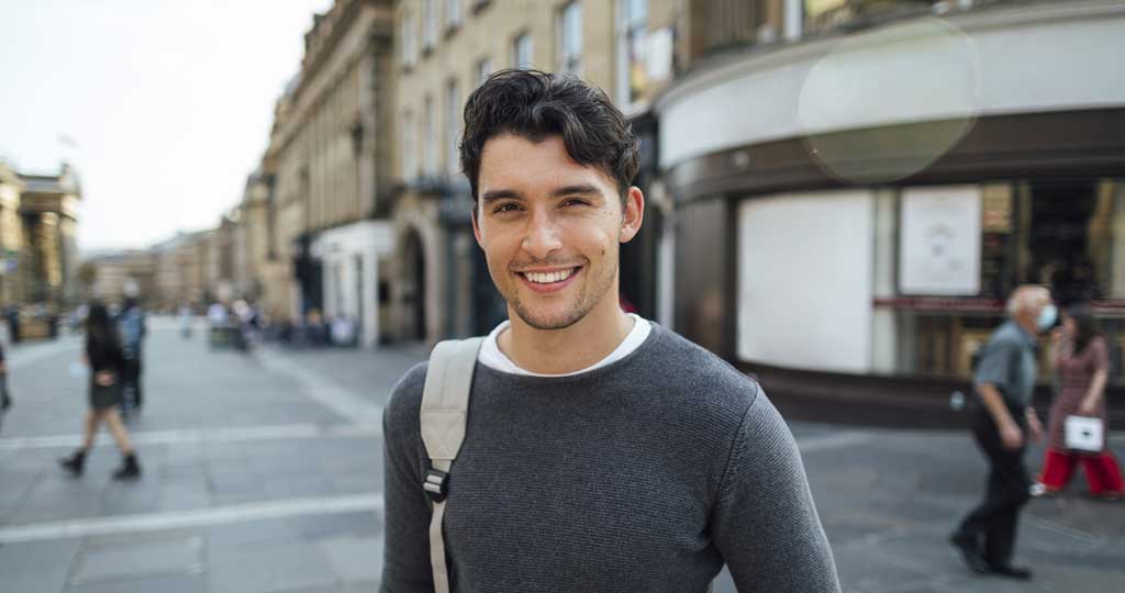 A young man smiling