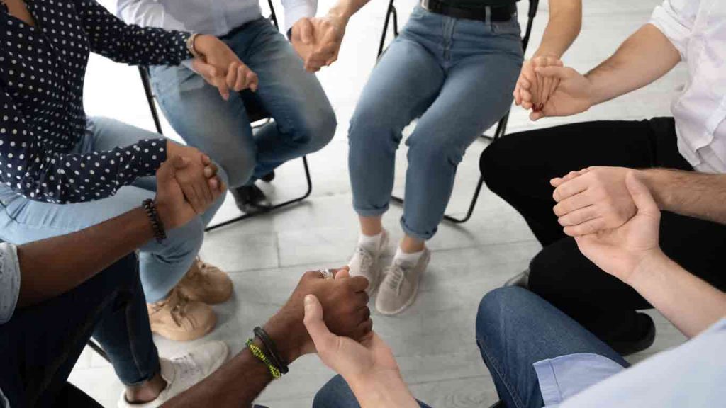 Group of people holding hands