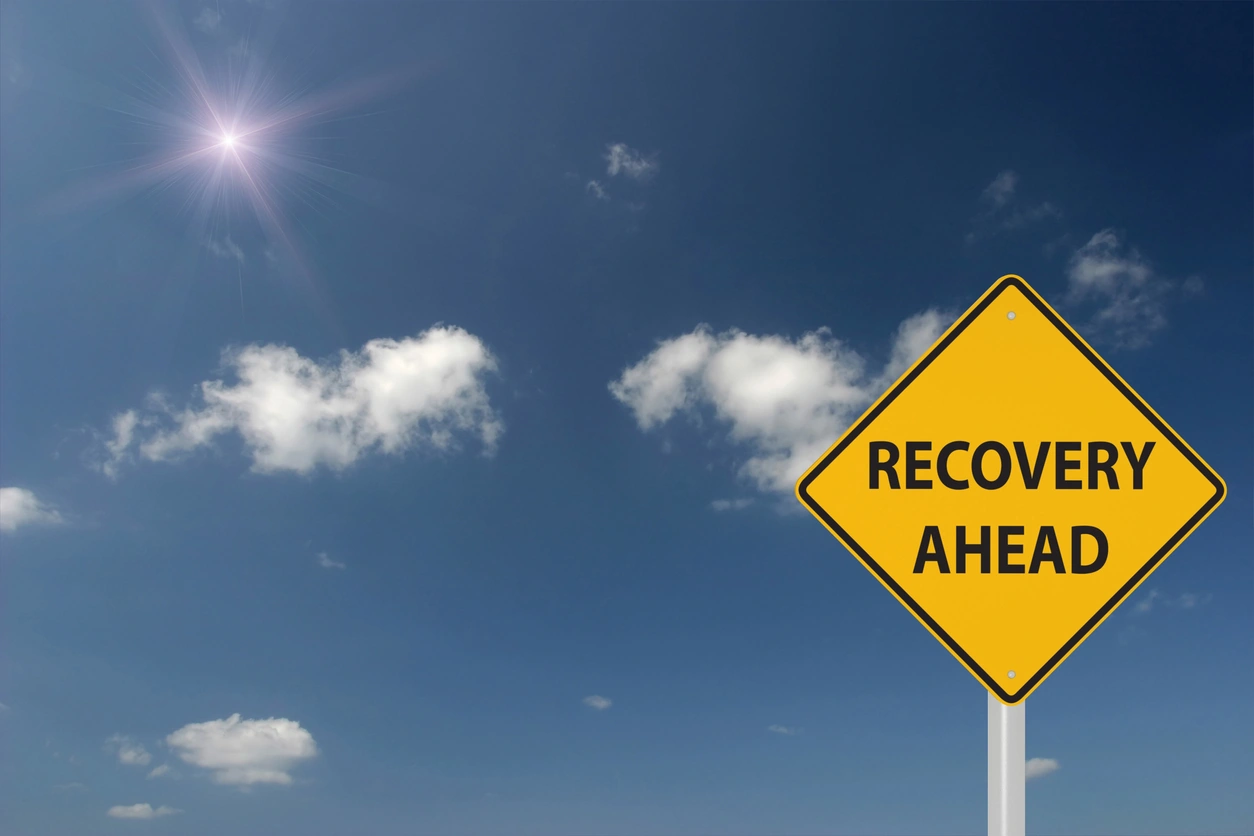 sign reading recovery ahead