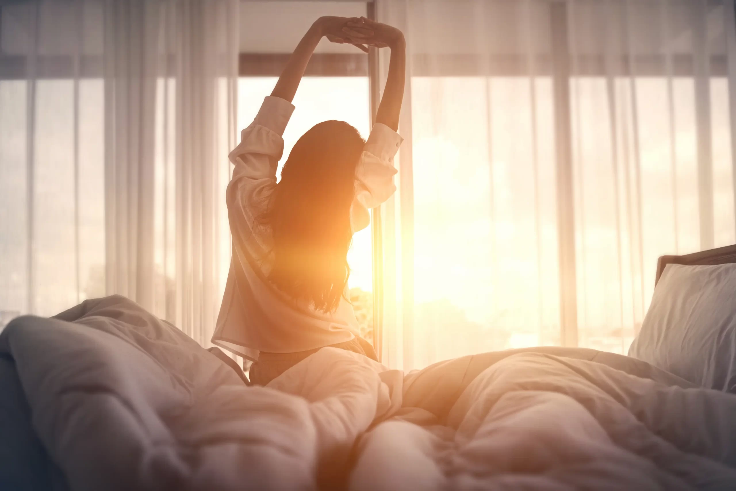 woman stretching waking up in the morning