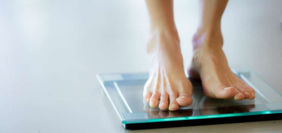 Why Do Drugs Cause Weight Loss? - an image of a woman on scales
