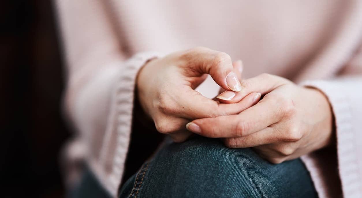 Close up of a woman with drunkorexia hands