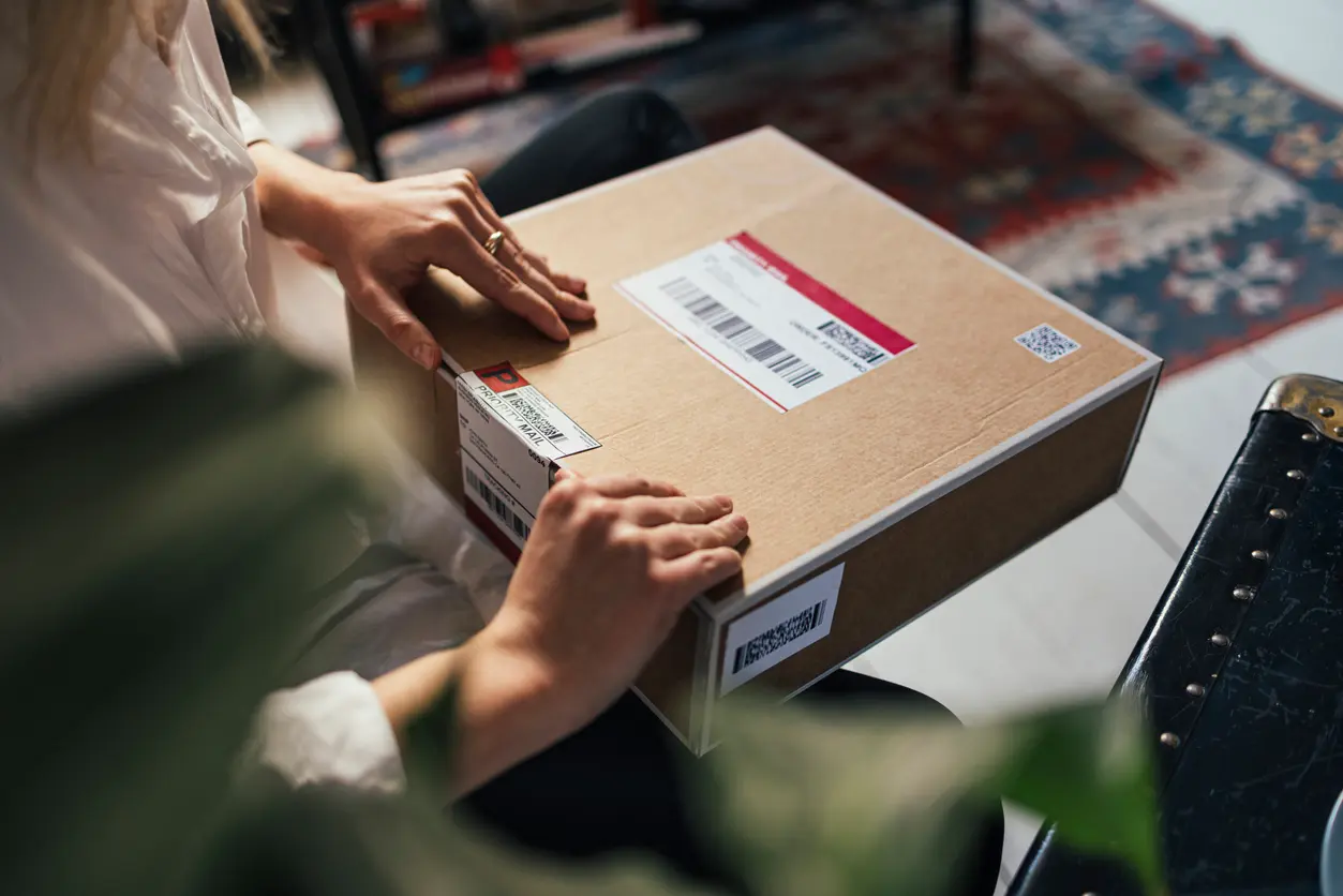 Lady opening a parcel