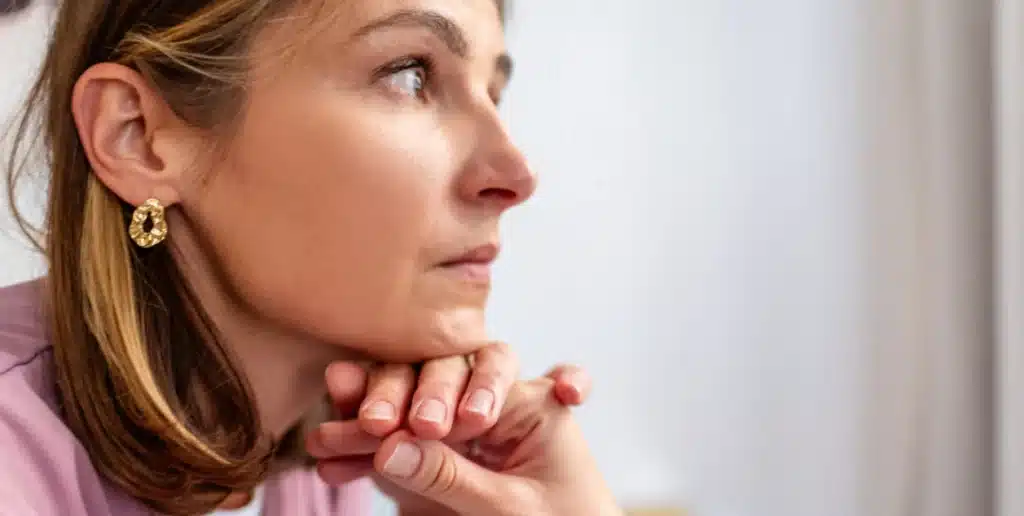 A woman appearing anxious after drinking