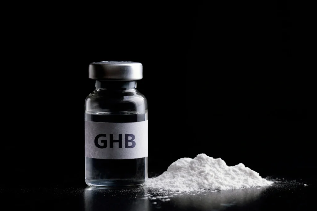 Image of GHB in a bottle and in white powder form.