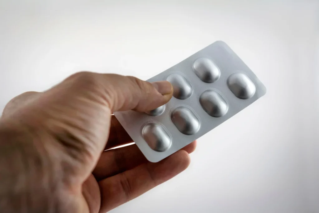 Ksalol, Alprazolam, in a medicine packet in man's hand